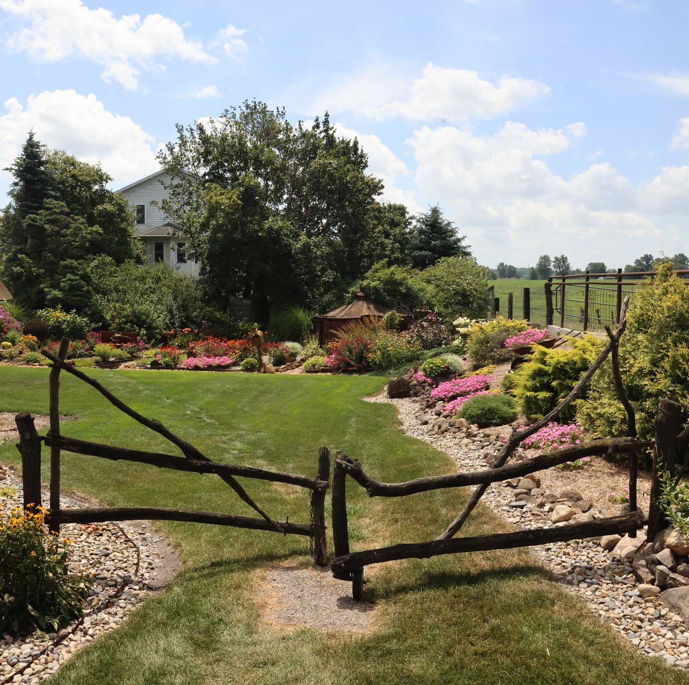 Farm, gate, and flower garden